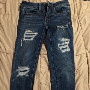 Dark washed ripped jeans